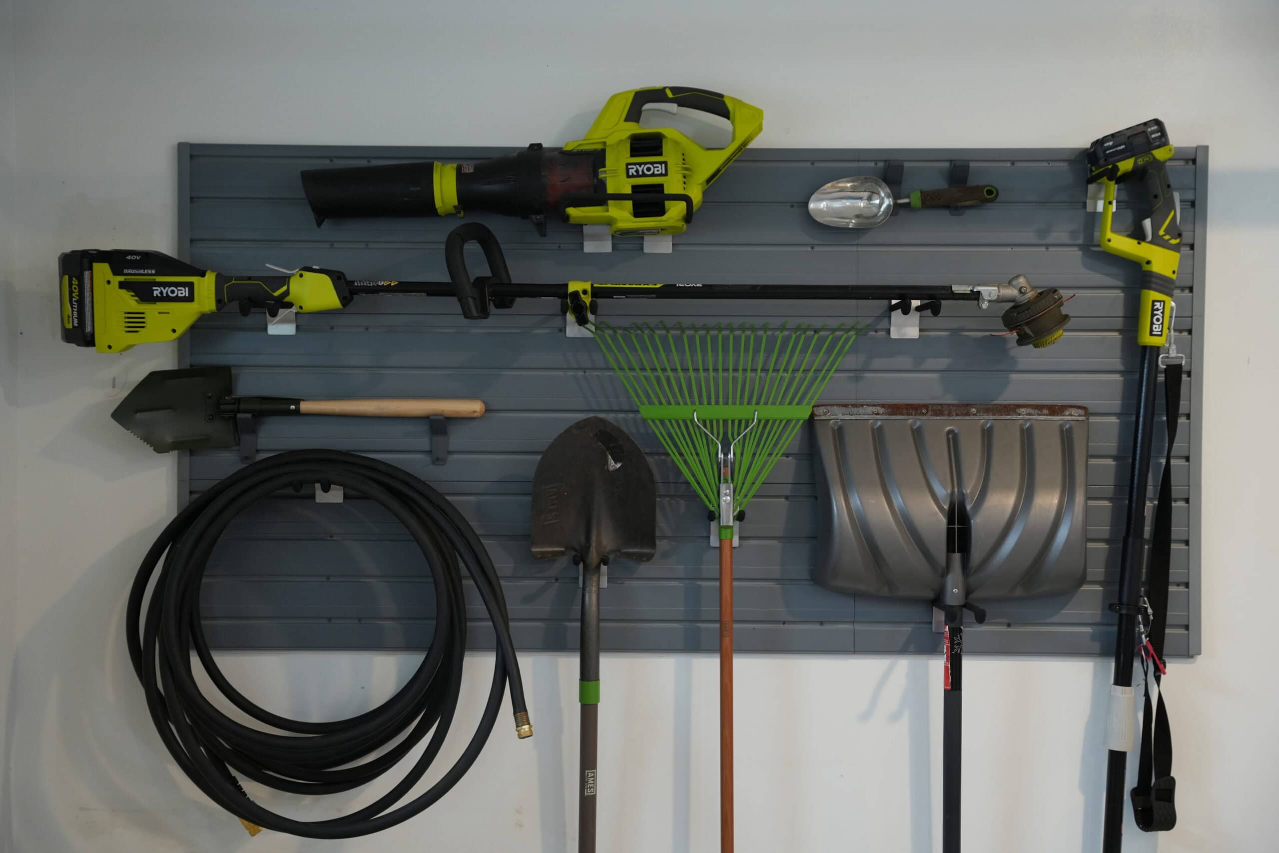 pegboard with garden supplies and tools
