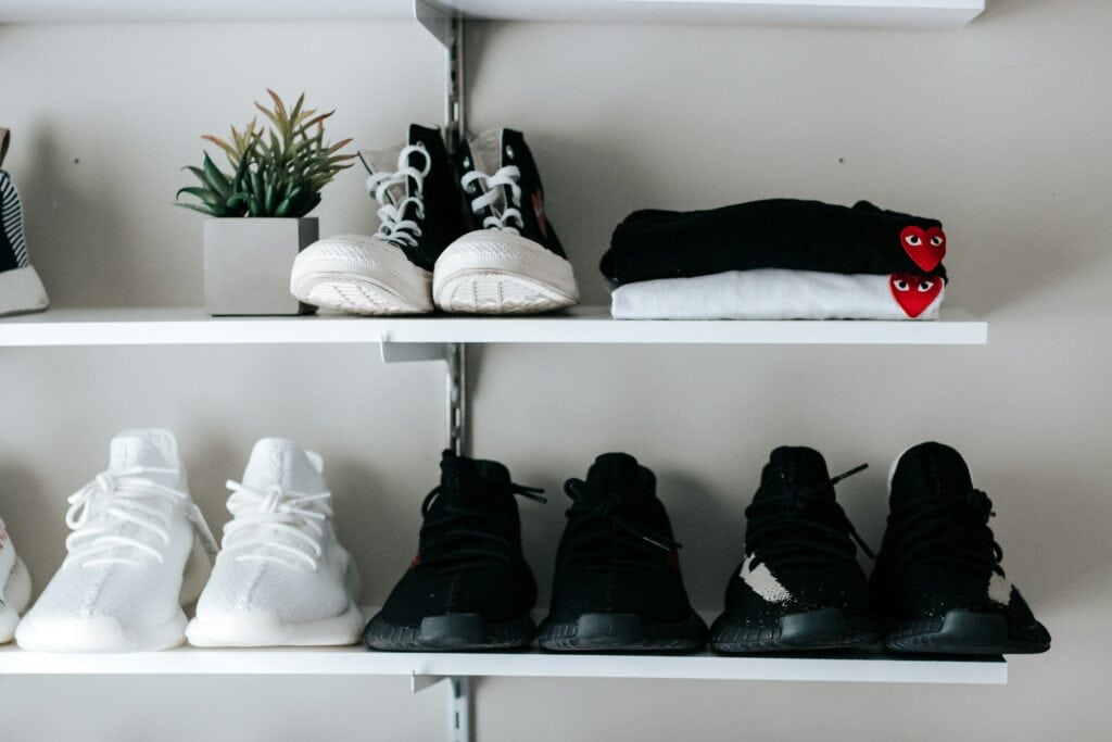 shelving with men's shoes and clothing