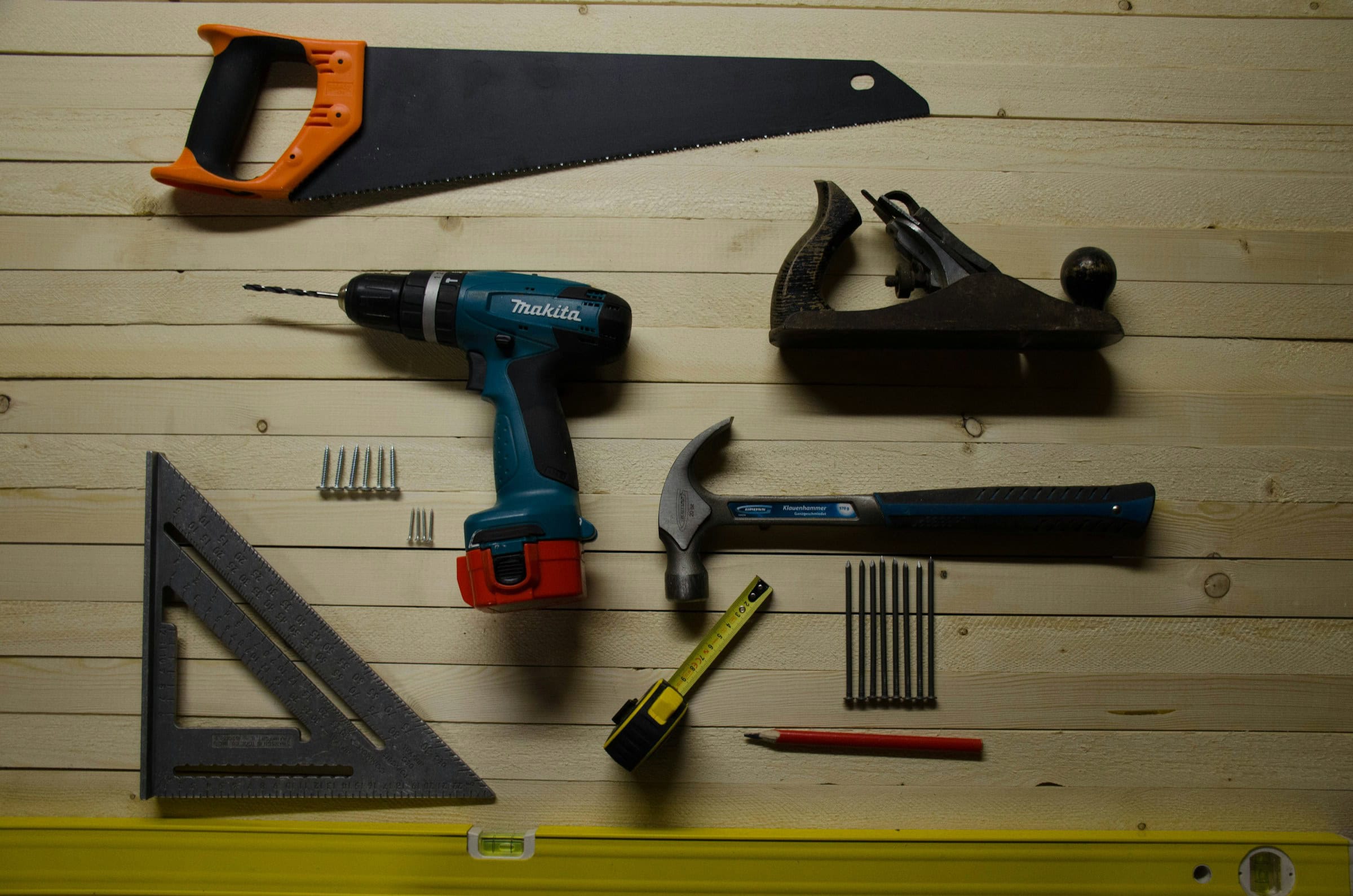 tools laid out on a wood shelf