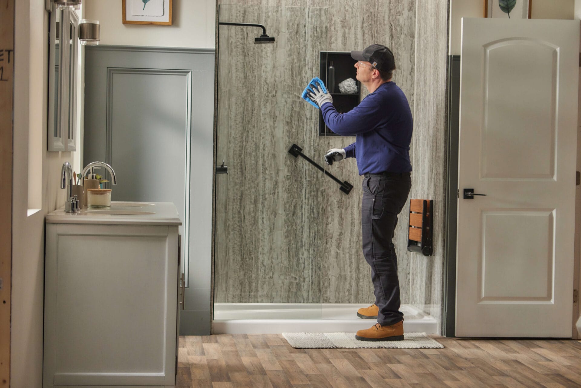 bath installation|Photo of a young couple counseling with bathroom remodeling contractor at home.|interviewing a contractor