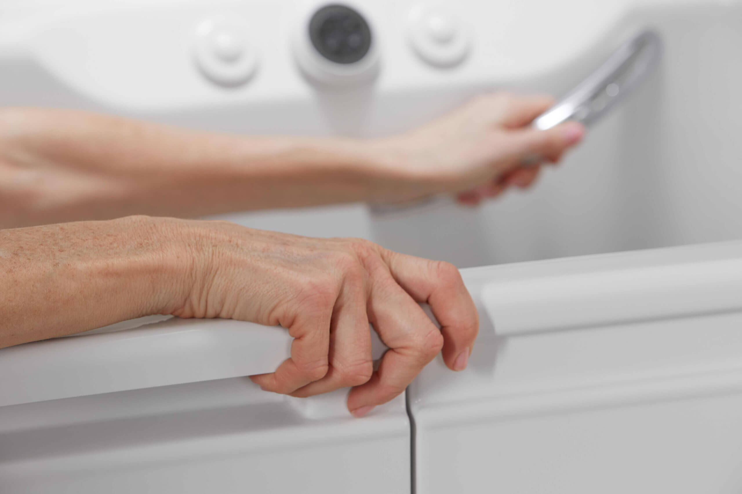 elderly woman getting out of bathtub|bathtub