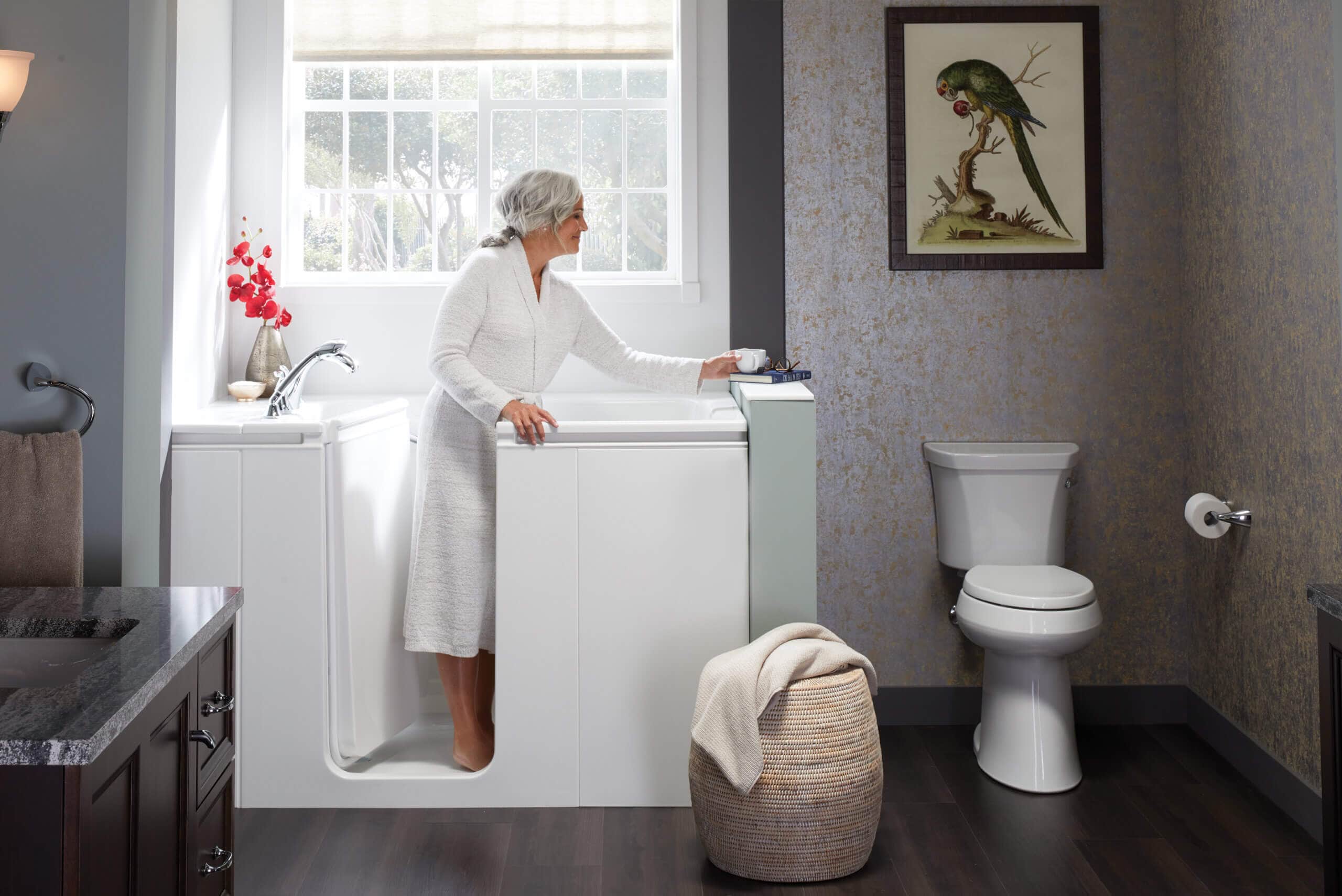elderly woman standing in a walk-in bath|elderly woman entering a walk-in bath