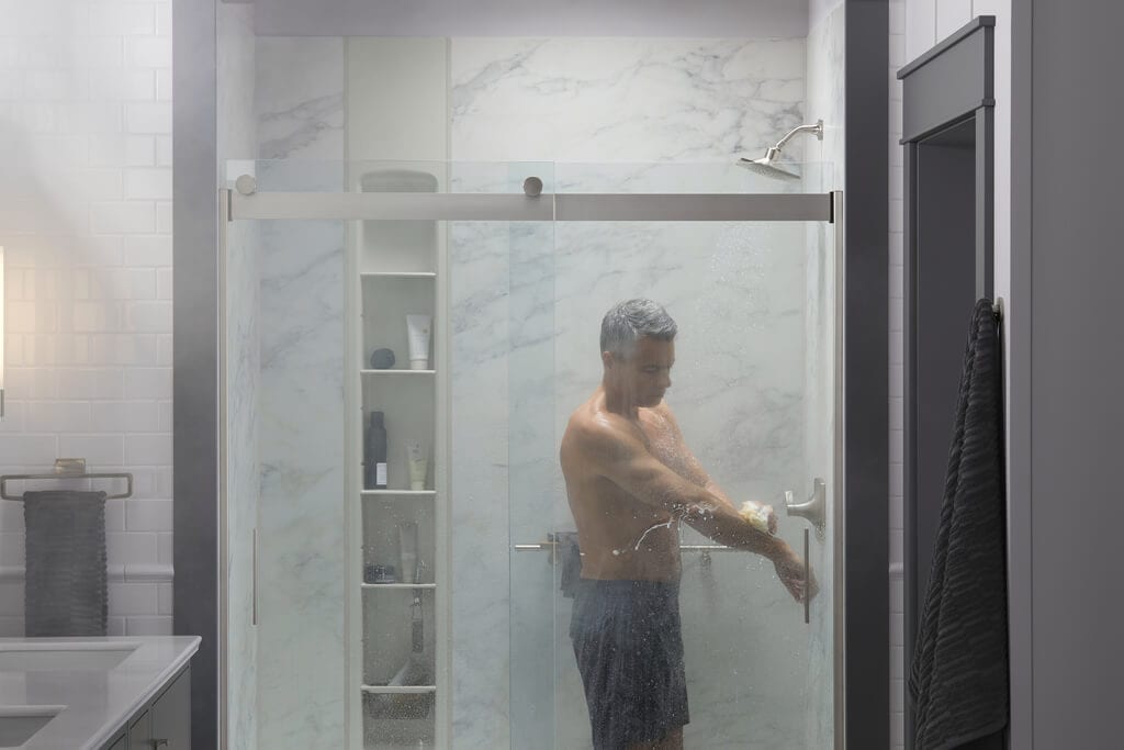 man taking a hot shower|person turning up the temperature of their shower|KOHLER DTV Digital interface